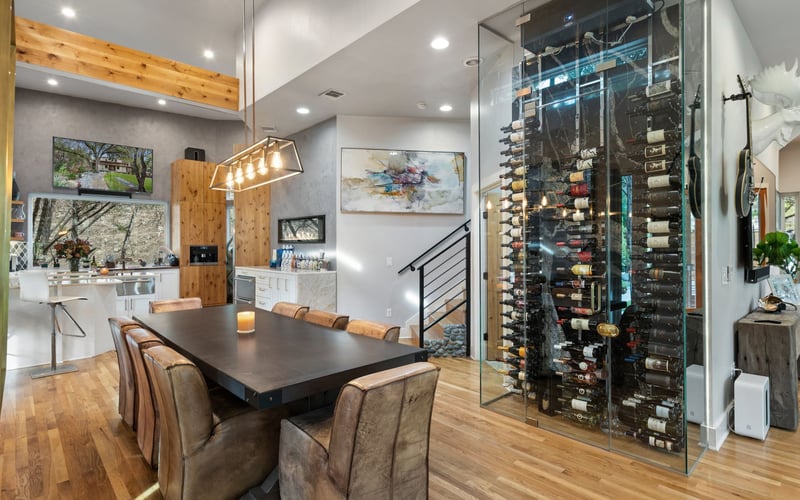 sophisticated luxury living room with large wine celler