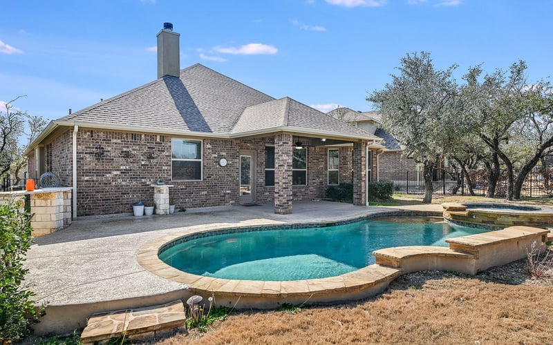 Beautiful home exterior with large pool